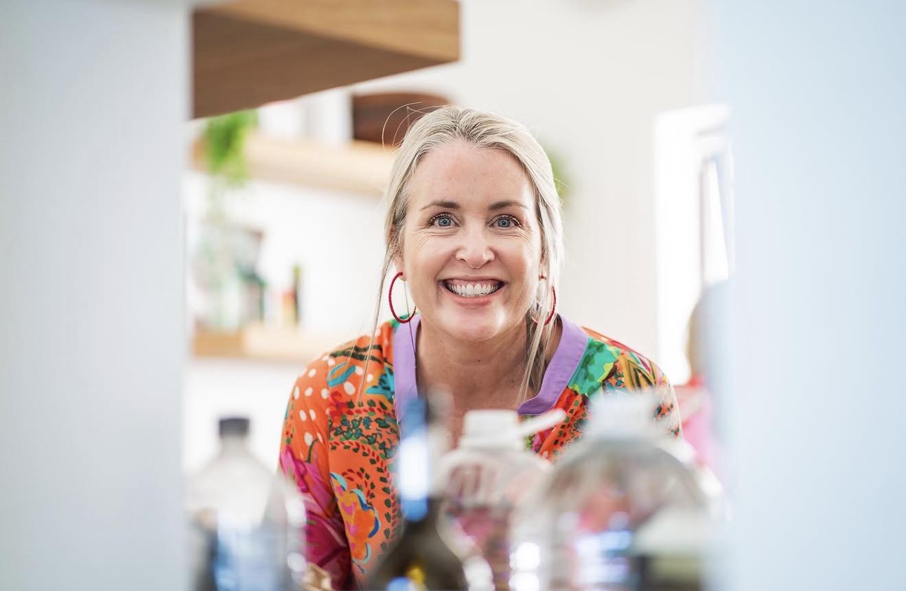 Margie, founder of The Fat Aubergine, smiling in a colourful floral shirt